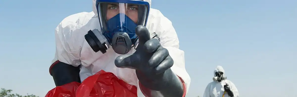 sewage clean up technician wearing protective gear handling biohazard materials in Omaha, NE