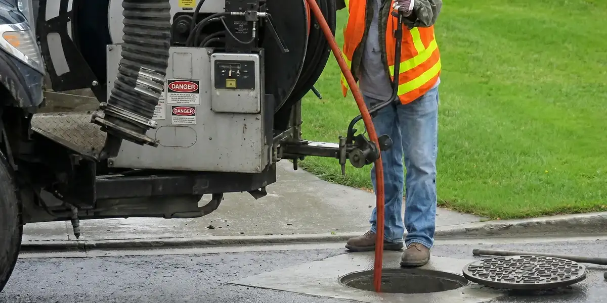 sewage clean up professionals using industrial equipment to remove contaminated wastewater in Omaha, NE