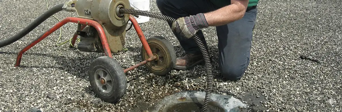 sewer rodding technician actively removing blockages from a sewer line in Omaha, NE