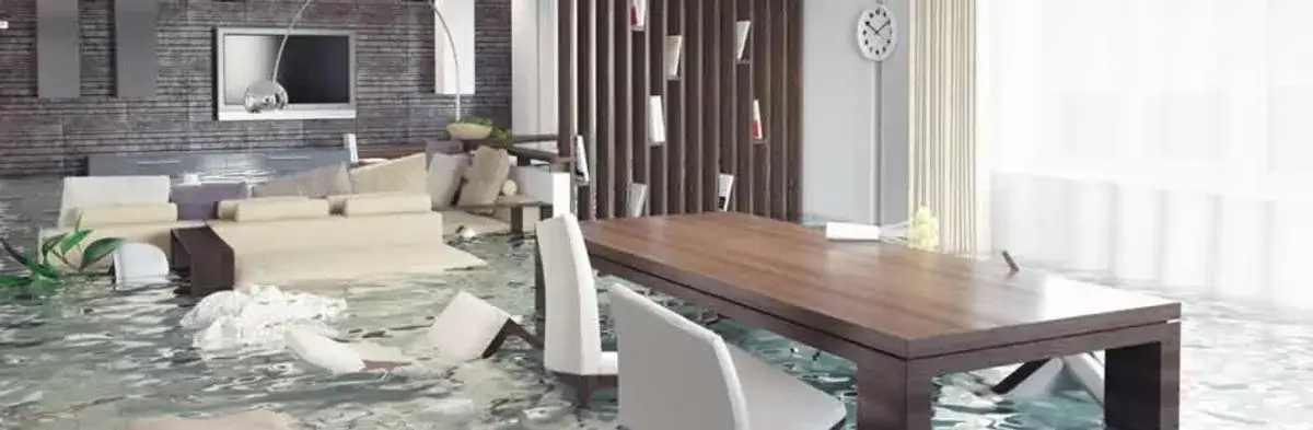 home interior affected by water damage with flooded floors and displaced furniture in Omaha, NE